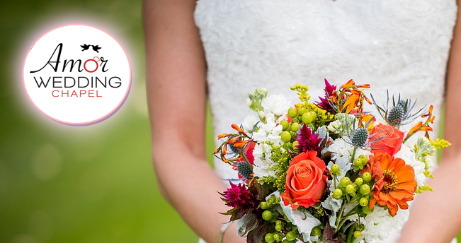 groom holding flower bouquet